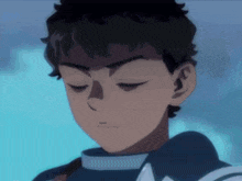 a close up of a boy with his eyes closed