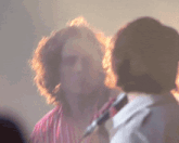 a blurry picture of a man 's face and a woman 's face