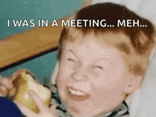 a young boy is making a funny face while holding an apple and the words " i was in a meeting ... meh ... "