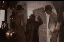 Indiana Jones Saluting Mnkey Raise Hand GIF - Indiana Jones Saluting Mnkey Raise Hand Smoking GIFs