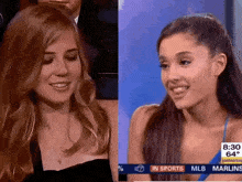 two women are sitting next to each other in front of a screen that says in sports on it