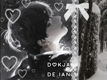 a black and white photo of a boy with the name dojka de jan