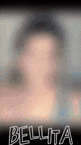 a blurred image of a woman with the name bellita written on the bottom
