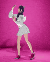 a girl with a cat ear hoodie and a white skirt is standing on a pink background