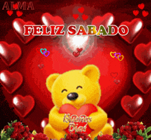 a yellow teddy bear holding a red heart with the words feliz sabado written above it
