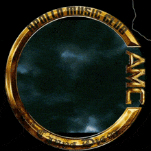 a gold circle with the word amc in the center
