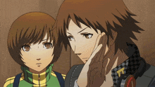 a man and a woman are standing next to each other and the man has a t on his jacket