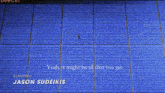 a man sits in a row of blue seats with hannah waddingham written in the corner