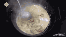 a spoon is being used to stir a sauce in a pot .