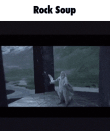 a video of a man holding a sword with the words rock soup below him