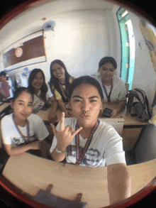 a girl with a lanyard around her neck that says ' philippines '