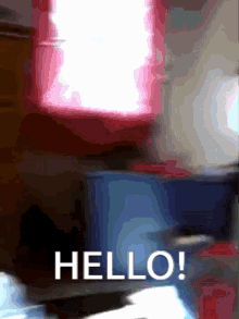 a blurred image of a room with the words hello in white letters