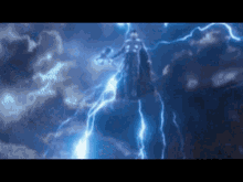 a man is standing in the middle of a lightning storm holding a hammer .