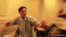 a blurry picture of a man dancing in a room