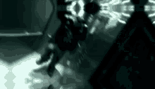 a black and white photo of a person falling into the water .