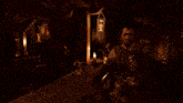 a man is standing in a dark room with a lantern and a mug
