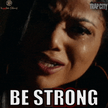 a poster for trap city with a woman crying