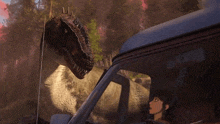 a woman is driving a car while a dinosaur is standing next to her .