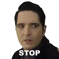 a man 's face is shown with the word stop on it