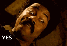 a man with a mustache is making a funny face with the words yes muthafuckaaa on the bottom