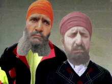 a man with a beard wearing an orange turban is next to another man with a beard wearing a plaid sweater