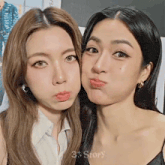 two women are posing for a picture and the words 3 story are on the bottom of the picture