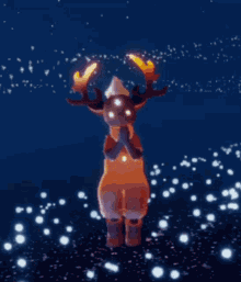 a person in a deer costume is holding a candle in their hands .