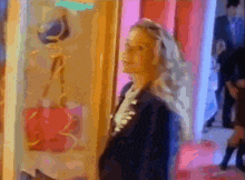 a woman is looking at a purse in a store