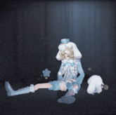 a girl with bunny ears on her head is sitting down