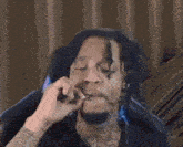 a blurry picture of a man talking on a cell phone
