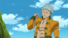 a man in a yellow jacket is holding a rope in his hand