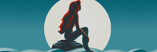 a silhouette of a mermaid sitting on a rock in the ocean