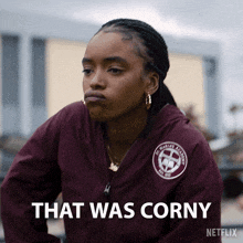 a woman wearing a maroon jacket says that was corny on netflix
