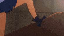 a girl in a blue shirt is sitting down