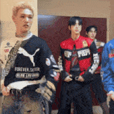 a group of young men are standing next to each other and one of them is wearing a shirt that says forever faster