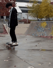 a person riding a skateboard in front of a wall that says nbs