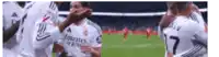 a group of soccer players are on a field and one of them has the number 7 on his jersey
