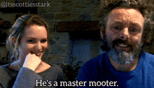 a man with a beard is talking to a woman who says he 's a master mooter