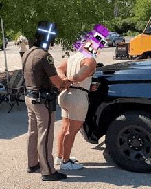 a man is being handcuffed by a police officer with a cross on his face