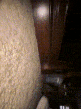 a close up of a wall with a light shining through it