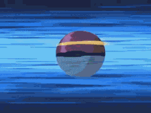 a red and white ball with a yellow stripe is floating in the water