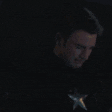 a man wearing headphones and a hoodie with the word adidas on the front