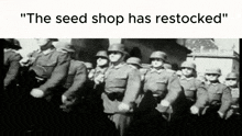 a black and white photo of a group of soldiers standing next to each other .