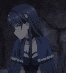 a girl with long black hair and a choker on her neck is smiling with her eyes closed