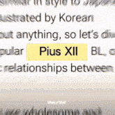 a blurred image of a text that says pius xii