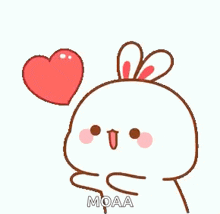 a bunny rabbit is holding a red heart in its mouth .