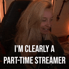 a woman sitting in front of a microphone with the words " i 'm clearly a part-time streamer "