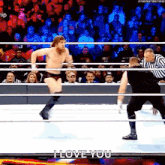 a wrestler is jumping out of a wrestling ring while a referee watches .