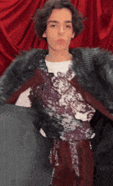 a man wearing a fur coat and a white shirt