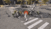 a blurred image of a destroyed city street with a red light in the middle .
